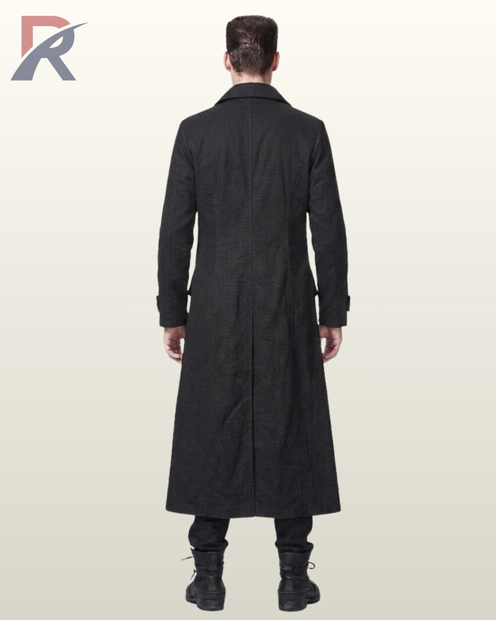 Full rear view of a male model wearing a floor-length black gothic trench coat displaying tailored back seams, high standing collar back, and center skirt split.