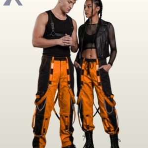 Full model view of a male and female wearing black and pumpkin orange two-tone gothic bondage cargo pants featuring contrast stitching and hanging chains.