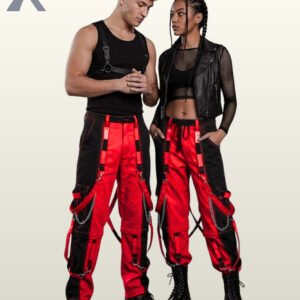 Couples catalog shot of two-tone red and black cyberpunk raver cargo pants featuring hanging bondage straps, silver chains, and platform combat boots.