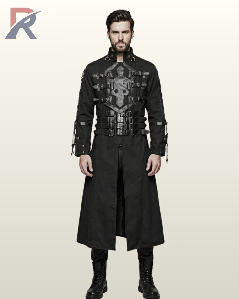 Full front model view of a man wearing a black gothic trench coat featuring a prominent faux leather skull chest plate, chest buckles, multi-strap waist belt, and lace-up sleeves.