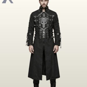 Full front model view of a man wearing a black gothic trench coat featuring a prominent faux leather skull chest plate, chest buckles, multi-strap waist belt, and lace-up sleeves.
