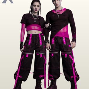 Full front model view of a couple wearing black cyberpunk cargo pants featuring hot magenta pink grommet straps, front zipper pockets, and contrast pink stitching.
