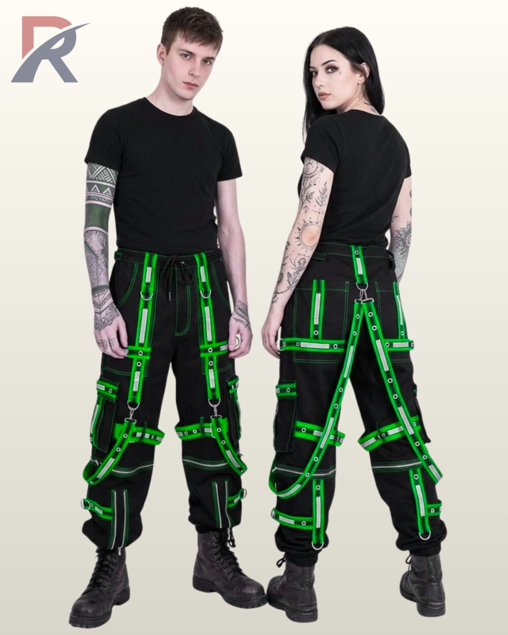 Man and woman modeling cyber goth wide-fit joggers featuring high-visibility neon green reflective trim and metal D-rings.