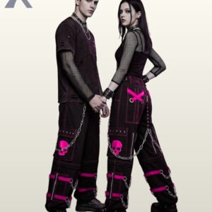 Full model view of a male and female wearing black gothic skull cargo pants with bright magenta pink contrast stitching, pink skull patch pockets, and metal chains.