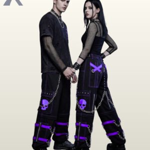 Couples model shot of black cyberpunk cargo trousers displaying royal purple buckle straps, skull graphics, side zippers, and hanging silver metal chains.