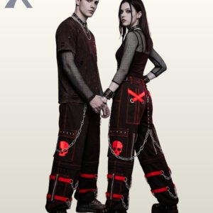Couples model shot of black cyberpunk cargo trousers featuring red buckle leg bands, skull pocket graphics, leg zips, and hanging silver chains.