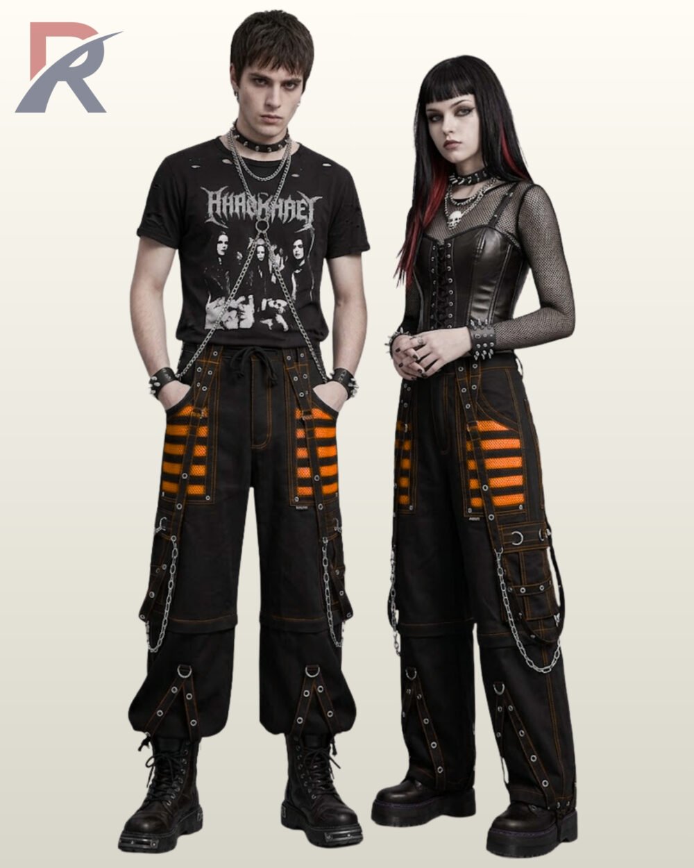 Couple in alternative wide-leg techwear trousers featuring vibrant orange mesh detail and hanging metal chains.