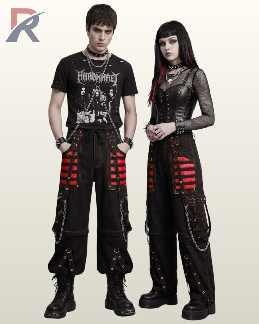 Couple wearing black gothic wide-leg cargo pants featuring red mesh paneling, red contrast piping, and metal chain hardware.