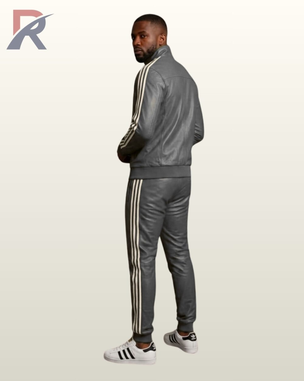 A designer ash gray leather activewear suit paired with white casual shoes.