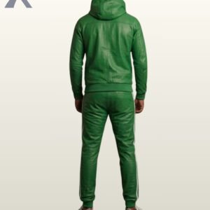 A designer kelly green leather activewear set worn with white and black sneakers.
