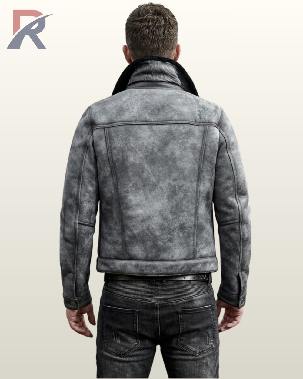 A close-up shot of a man modeling a vintage grey suede trucker jacket featuring a black fur collar.