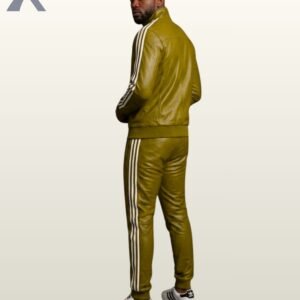 A man posing in an olive green leather mock-neck tracksuit featuring white side stripes.