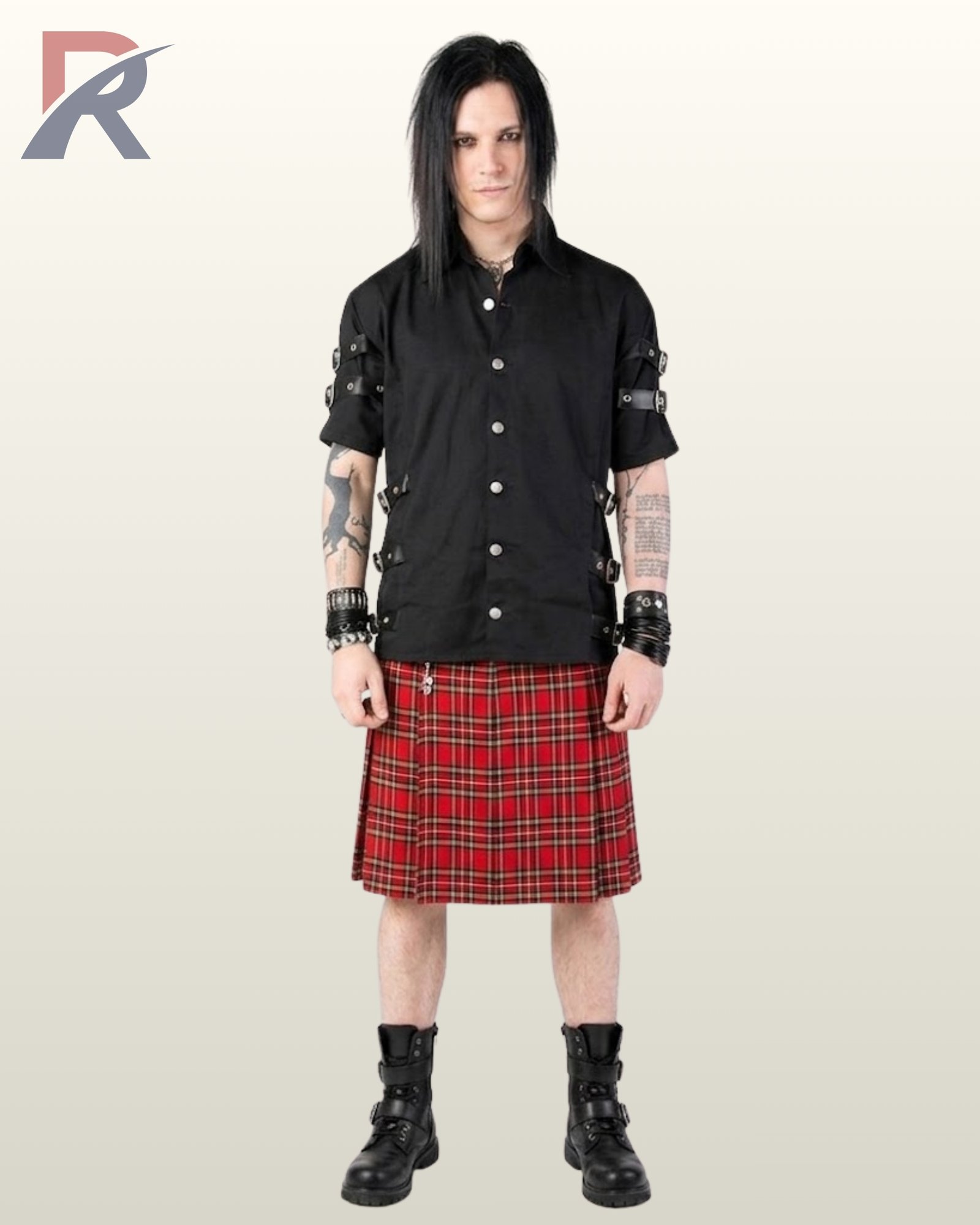 Full front model view of a long-haired man wearing a black short-sleeve gothic shirt featuring sleeve and side-waist buckle straps styled with a traditional red tartan kilt.