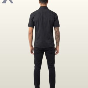Back perspective of a men's black short sleeve button-down punk shirt displaying clean shoulder yoke construction and straight hem.