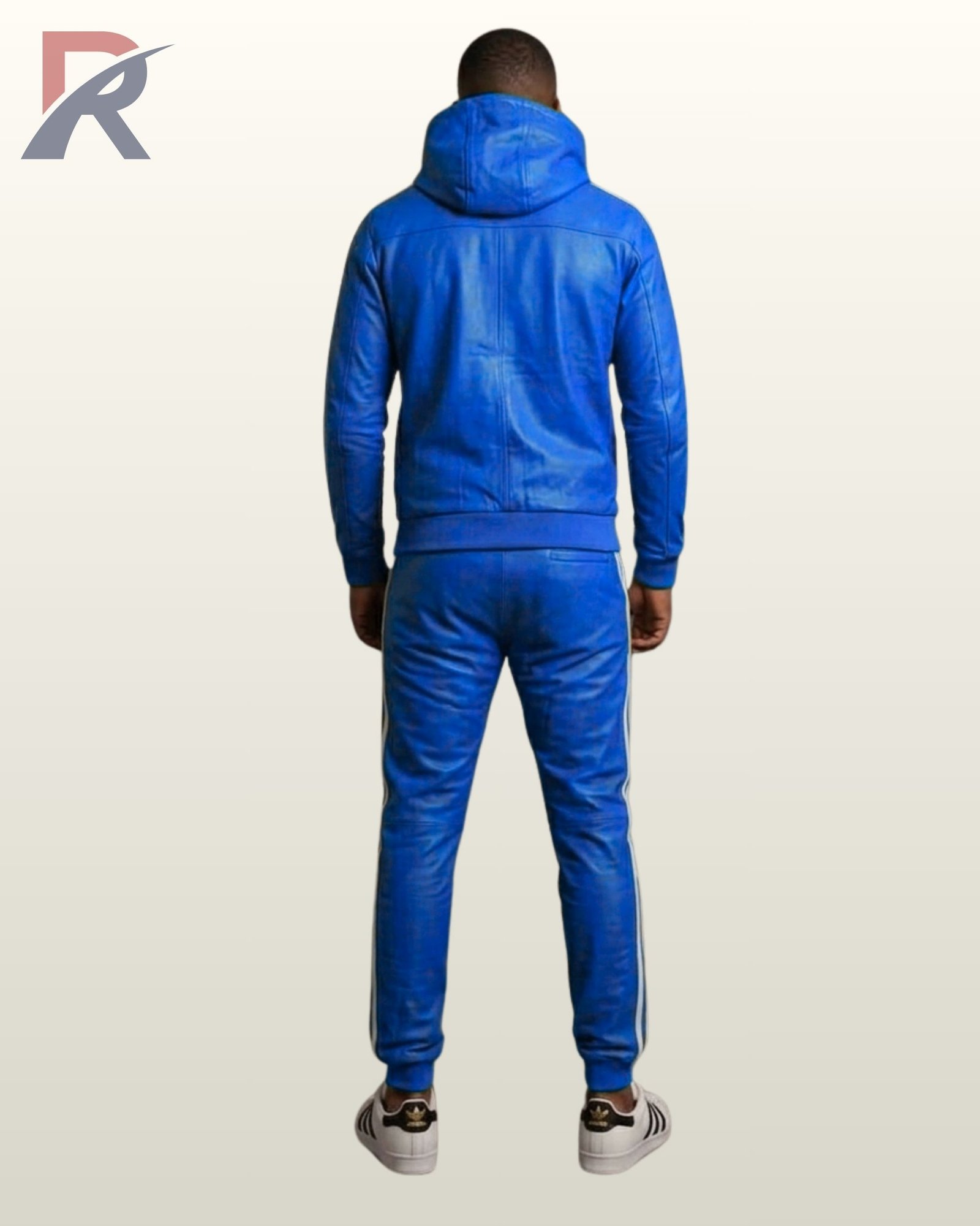 A model wearing a premium royal blue leather hoodie and matching pants activewear set