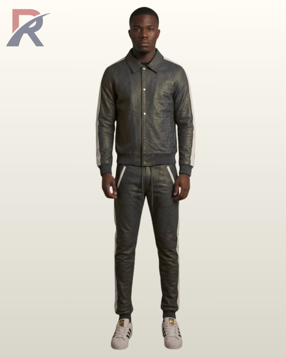A man wearing a charcoal gray leather tracksuit with white side stripes.