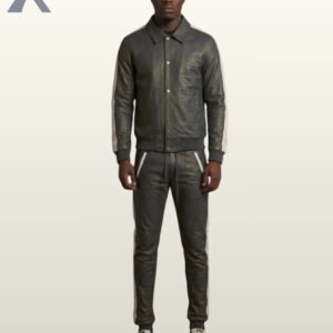 A man wearing a charcoal gray leather tracksuit with white side stripes.