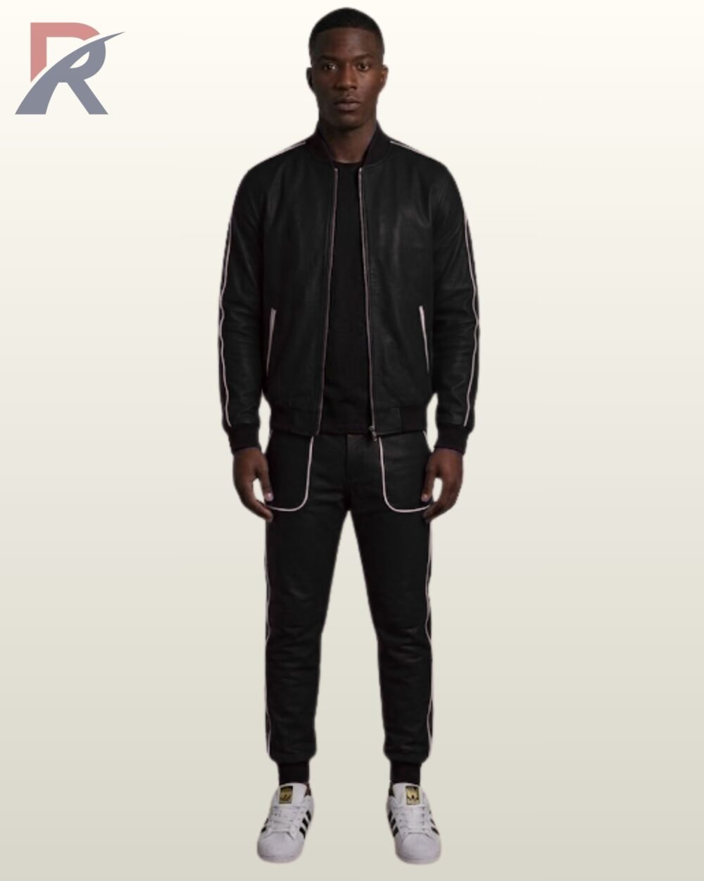 Man wearing a classic all-black leather tracksuit set with white contrast piping.