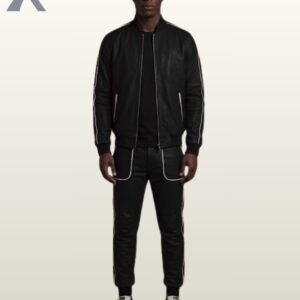 Man wearing a classic all-black leather tracksuit set with white contrast piping.