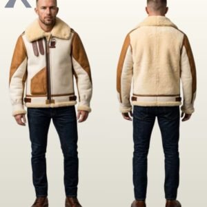 A model showcasing a premium two-tone sheepskin aviator jacket featuring an off-white suede body and tan brown leather panel accents.