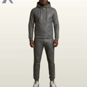 A designer dark gray leather activewear suit paired with white casual sneakers.