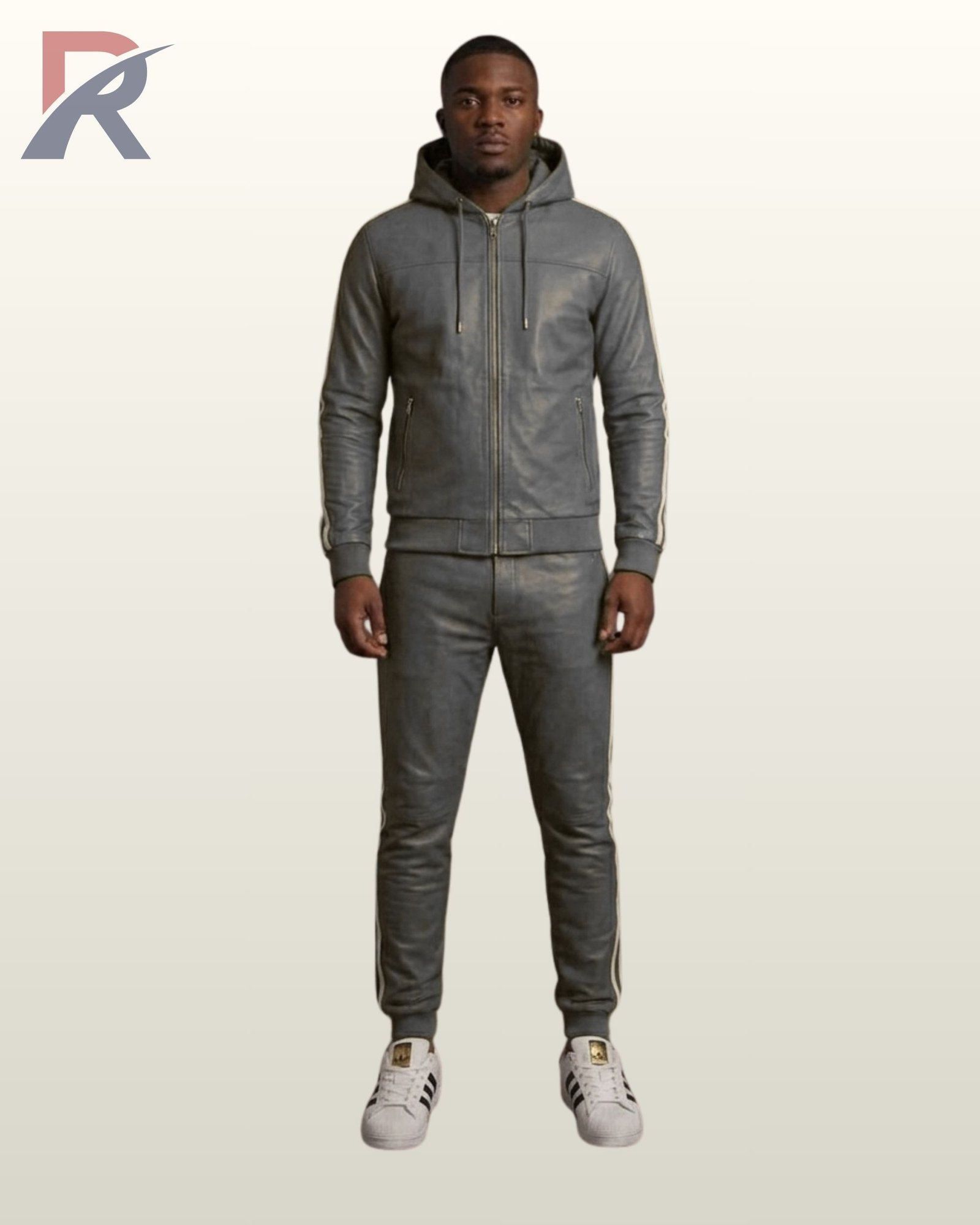 A designer dark gray leather activewear suit paired with white casual sneakers.
