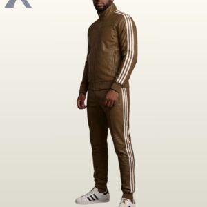 A man modeling an olive brown leather high-neck tracksuit with colored stripes.