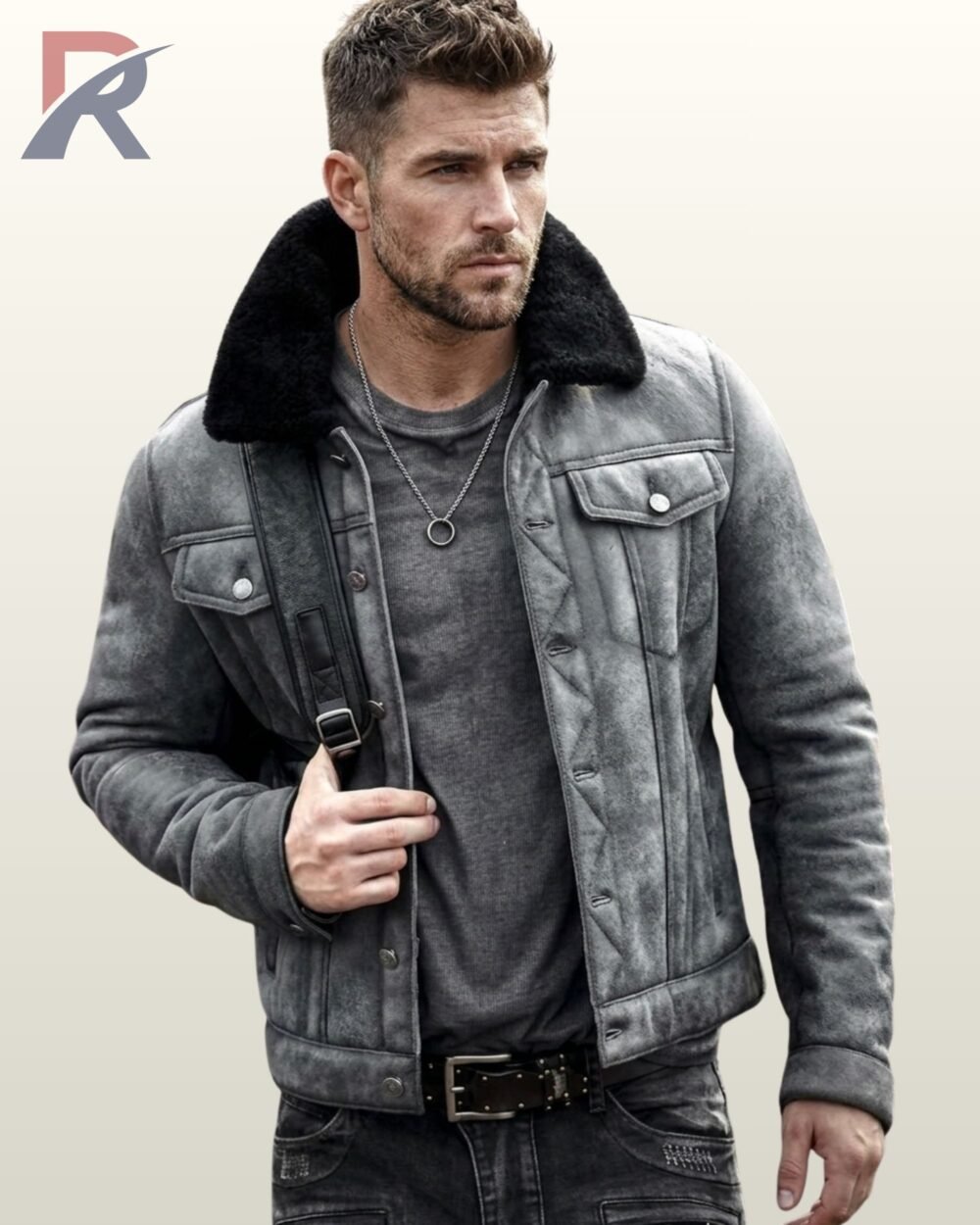 A model wearing a premium washed grey suede winter jacket with black fleece lining on the collar.
