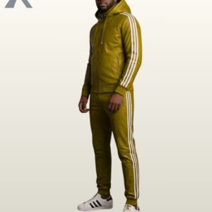 A profile shot of a mustard green leather hoodie and matching fitted joggers.