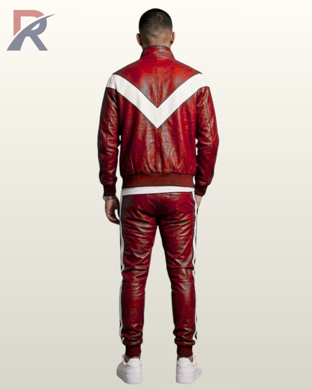 Streetwear styled red leather two-piece athletic suit paired with crisp white sneakers.