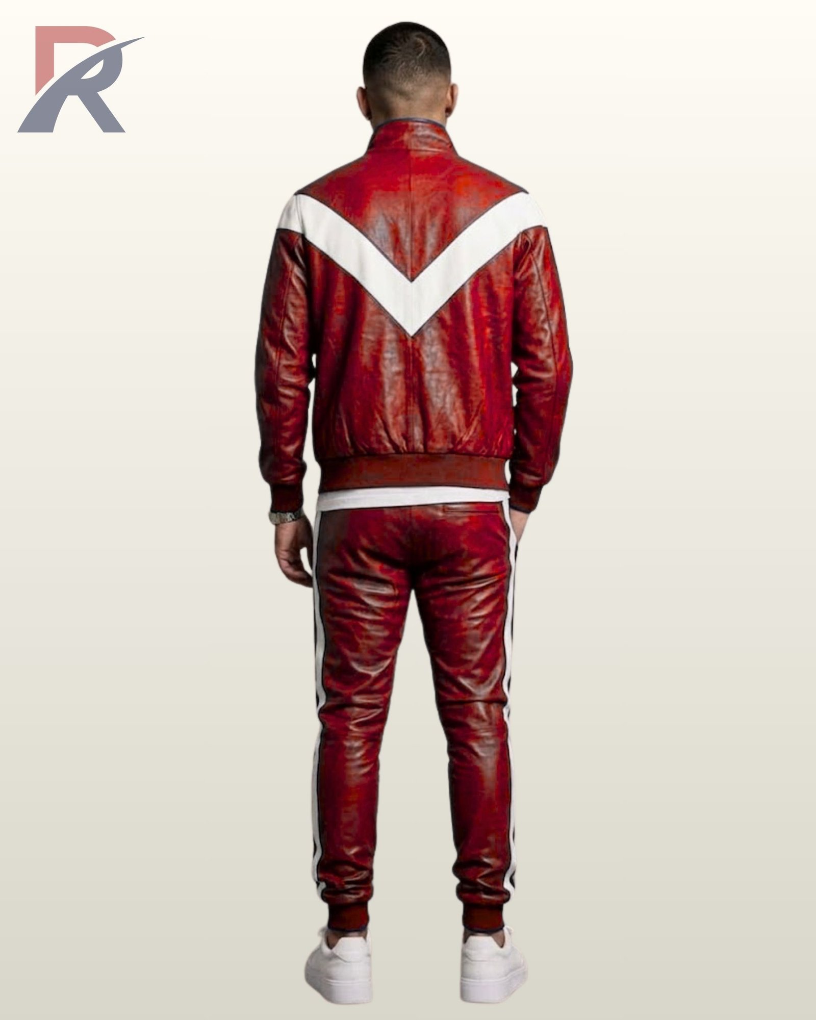 Streetwear styled red leather two-piece athletic suit paired with crisp white sneakers.