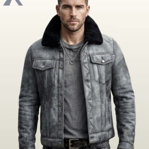A man wearing a distressed gray suede jacket with a black shearling fur collar.