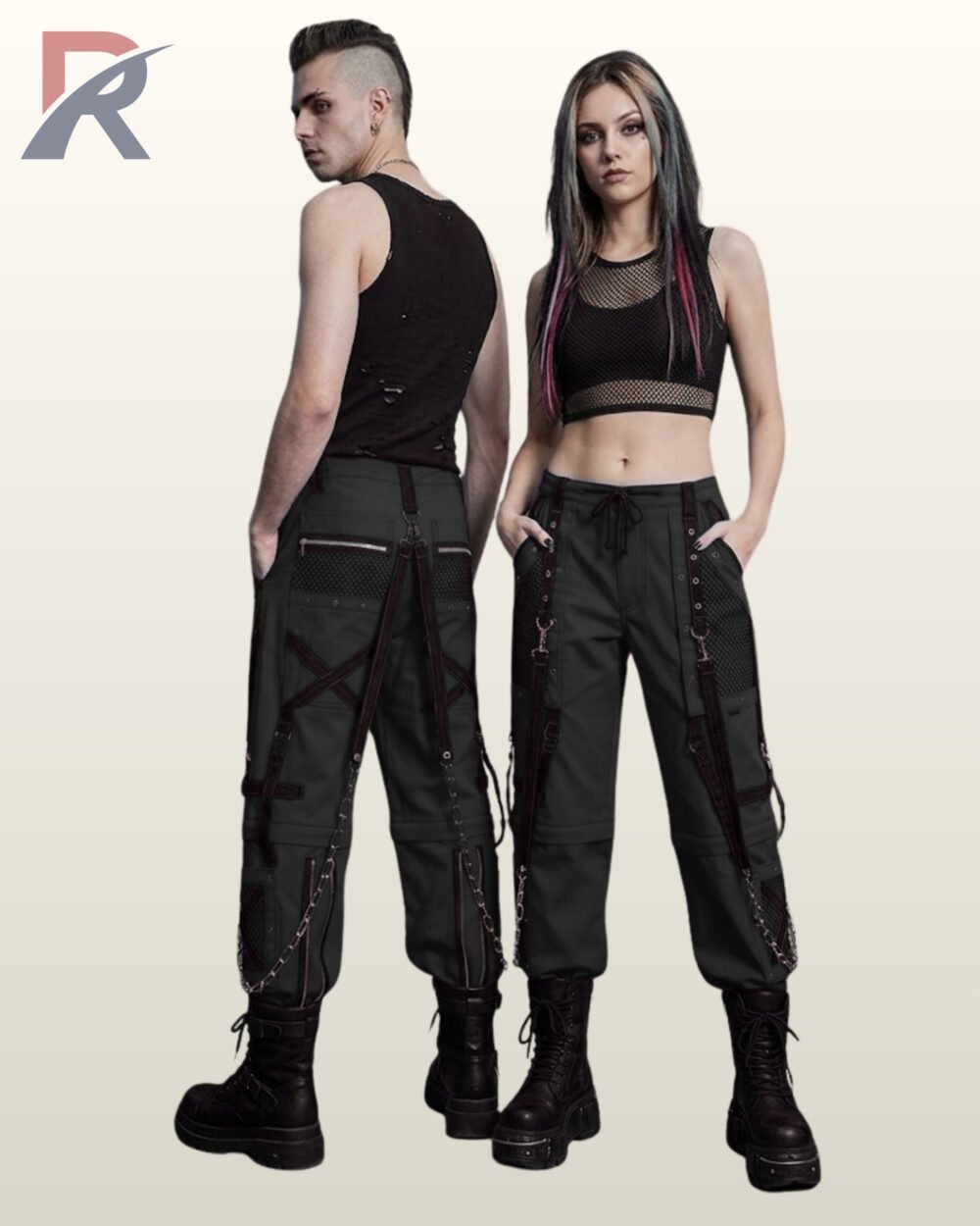 Couple modeling dark charcoal grey gothic cargo trousers styled with black straps, mesh pockets, and metal chain details.