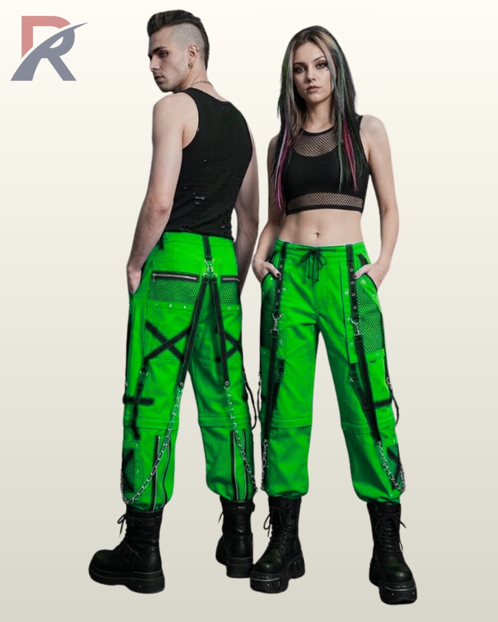 Couple wearing bright neon green gothic cargo pants with black mesh details, crisscross straps, and metal chain hardware.