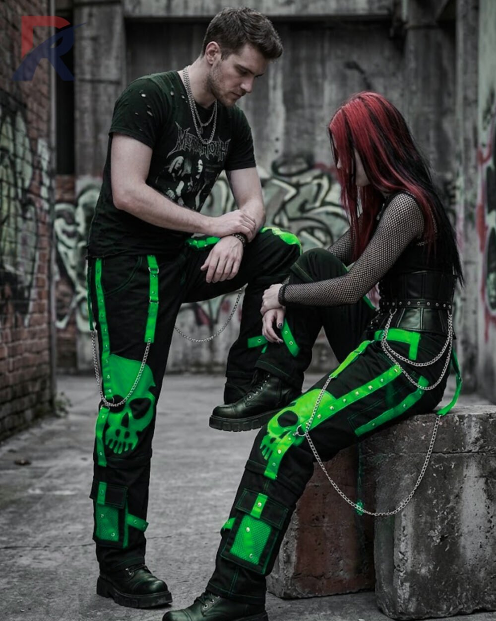 Wide-leg alternative black trousers with vibrant lime green skull prints and metal D-rings.