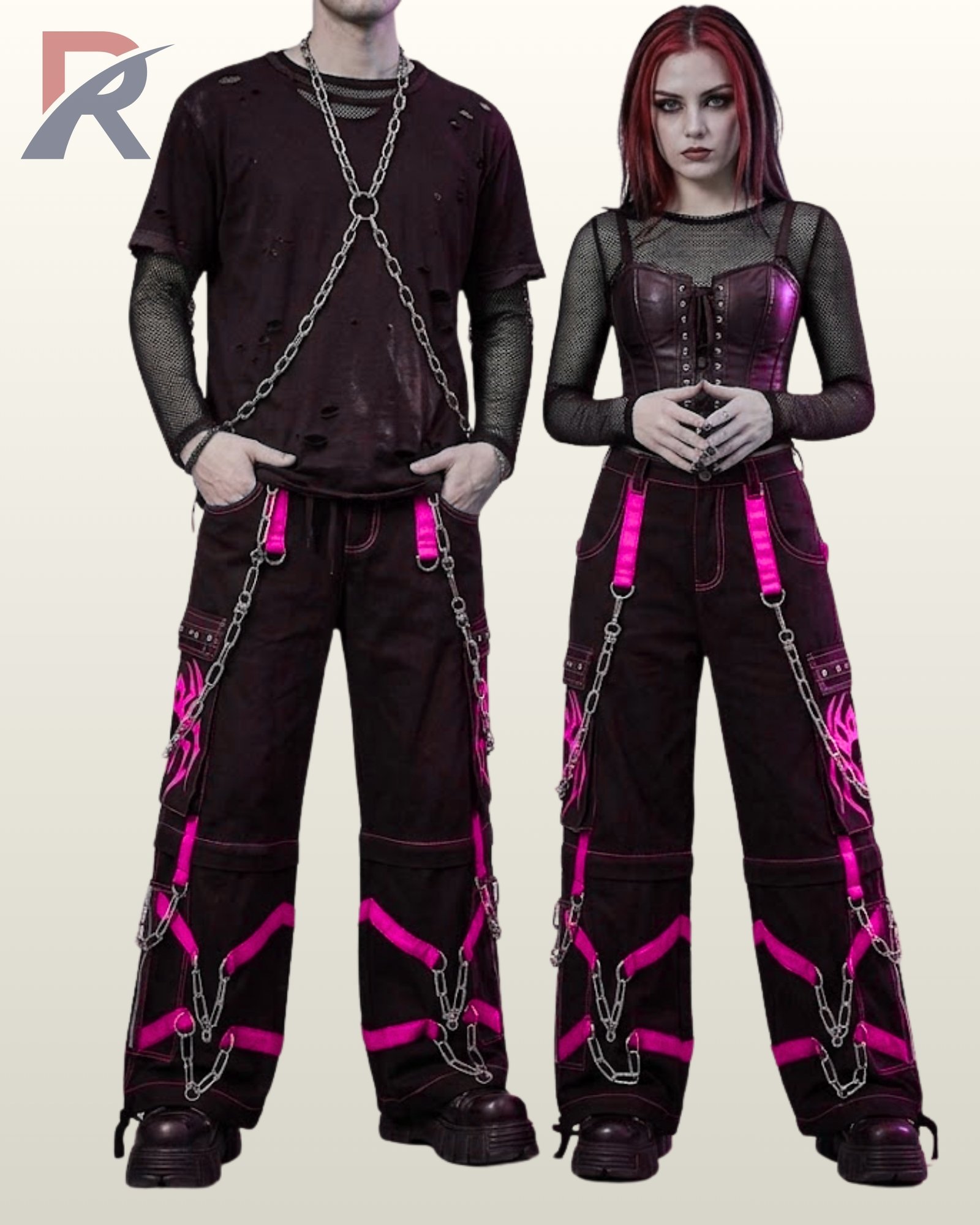 Gothic couple posing in loose black cargo pants with high-contrast pink graphic artwork.