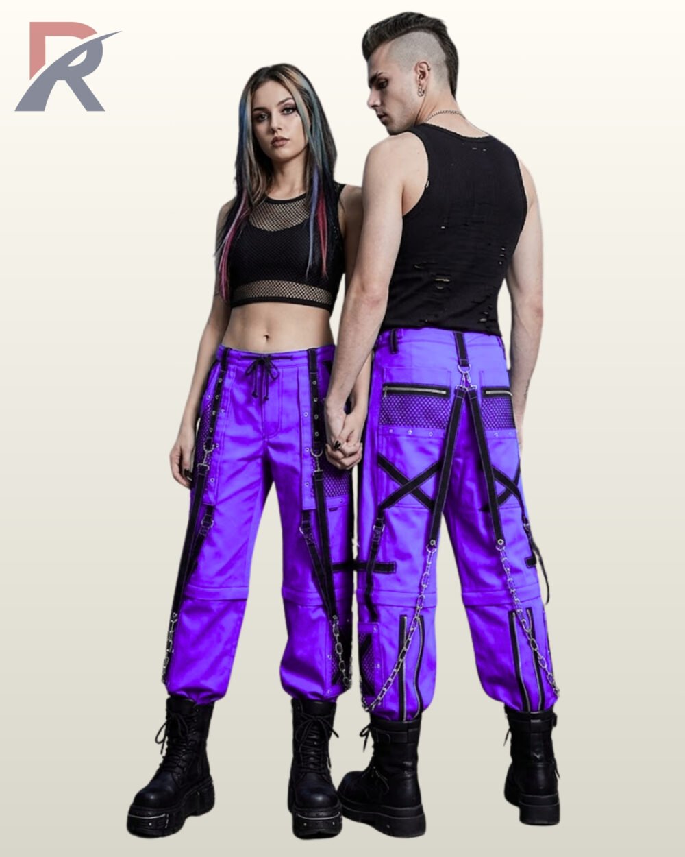 Couple in electric purple gothic cargo pants featuring black mesh panel pockets, eyelet straps, and silver metal chains.