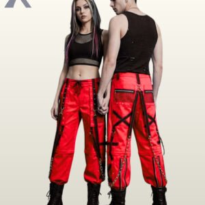 Couple wearing bold red gothic cargo pants with black mesh panels, eyelet straps, and silver chain details.