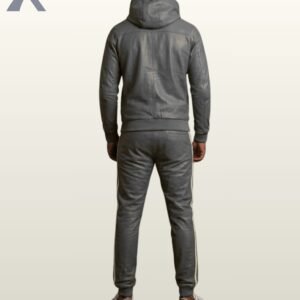 A man modeling a charcoal gray leather hoodie and sweatpants set with white trim