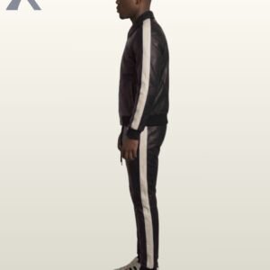 A designer black leather athletic suit featuring minimal white pocket accents.