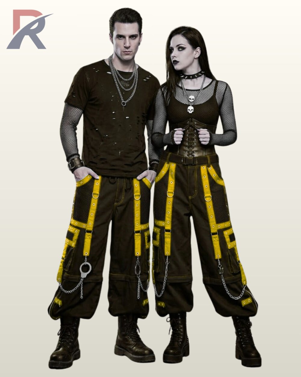 Punk rock inspired baggy black trousers with neon yellow strap details and silver chain accents.