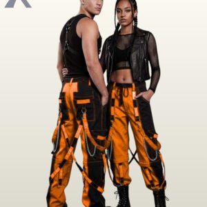 Couples model view of two-tone orange and black cyberpunk cargo trousers displaying D-ring bondage straps, side metal chains, and platform boots.