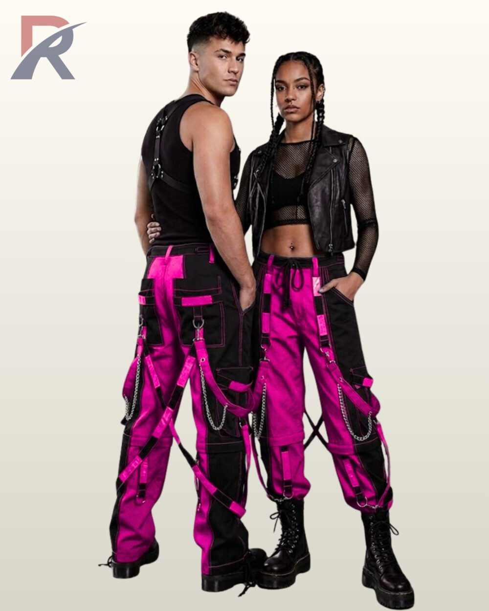 Full model view of a male and female wearing black and hot magenta pink two-tone gothic bondage cargo pants with hanging silver chains and D-ring straps.