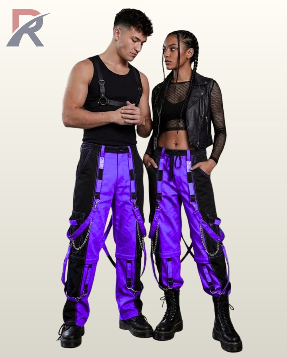 Full model view of a male and female wearing black and royal purple two-tone gothic bondage cargo pants with silver chains and D-ring strap accents.