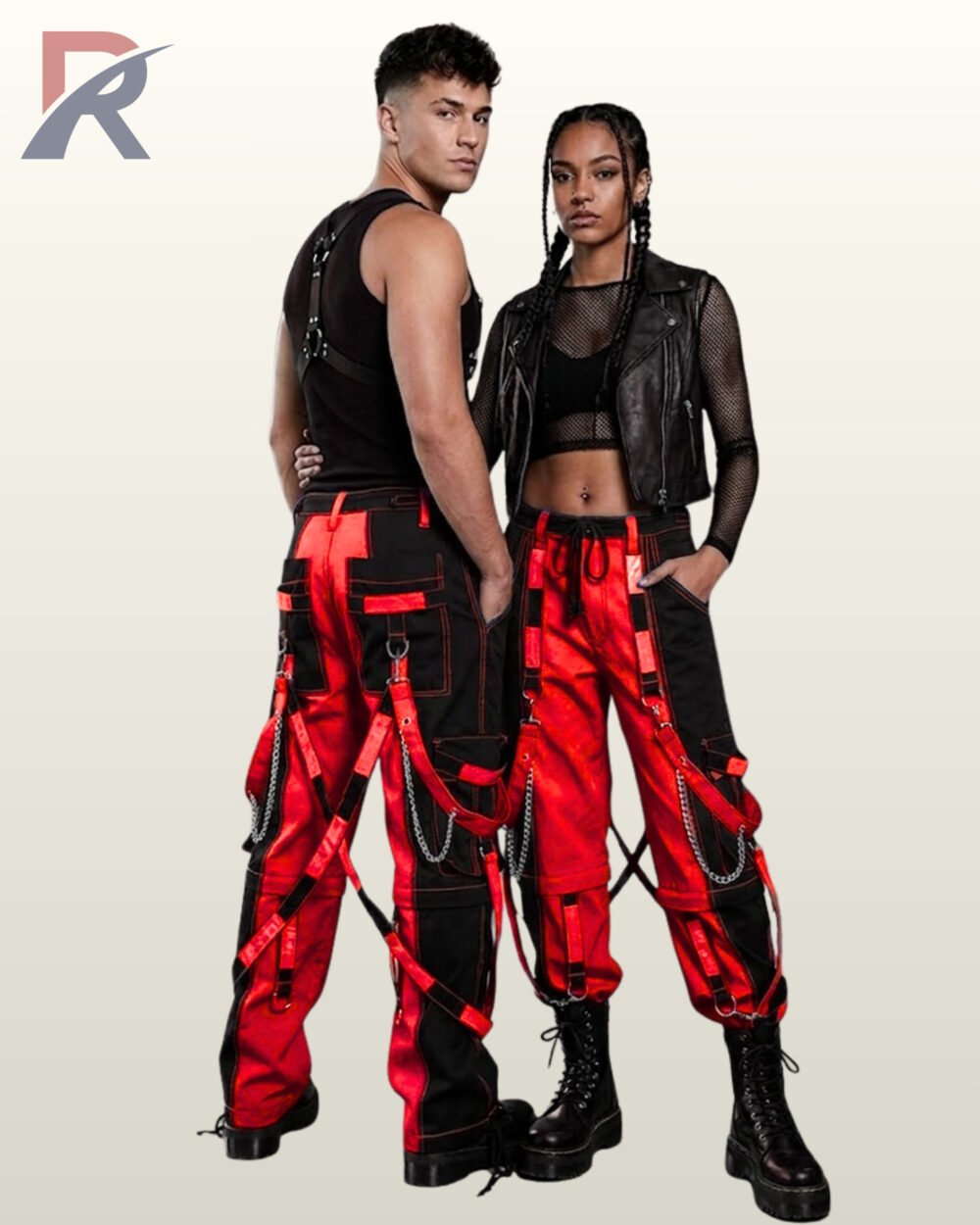Full model view of a male and female wearing black and crimson red two-tone gothic bondage cargo pants with hanging silver chains and D-ring straps.