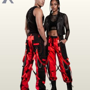 Full model view of a male and female wearing black and crimson red two-tone gothic bondage cargo pants with hanging silver chains and D-ring straps.