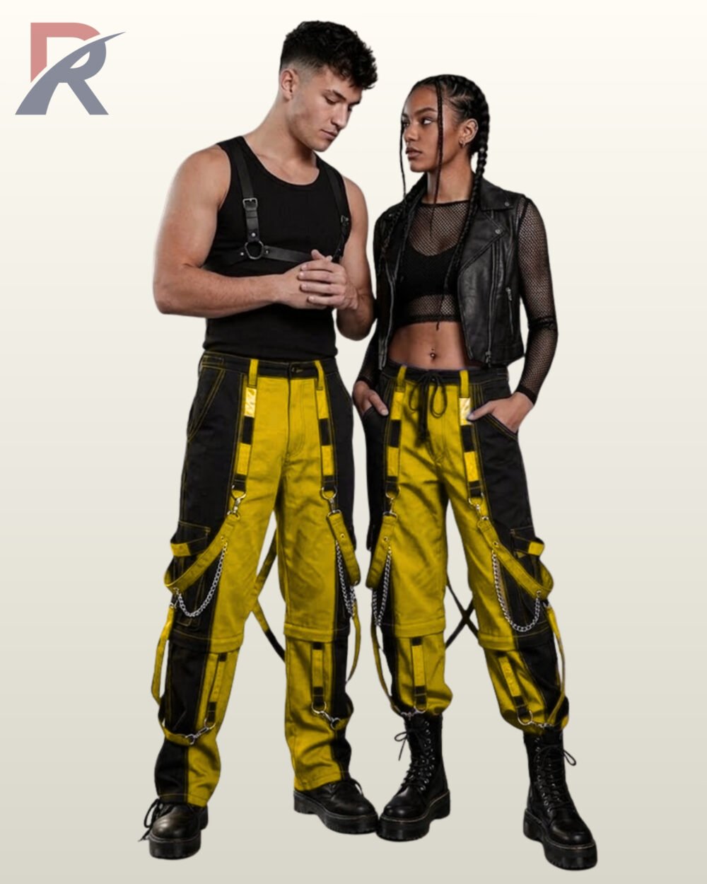 Couples catalog display of two-tone yellow and black cyberpunk raver trousers featuring hanging D-ring bondage straps, side chains, and combat boots.