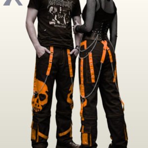 Gothic couple wearing wide-leg black pants detailed with neon orange skull artwork.