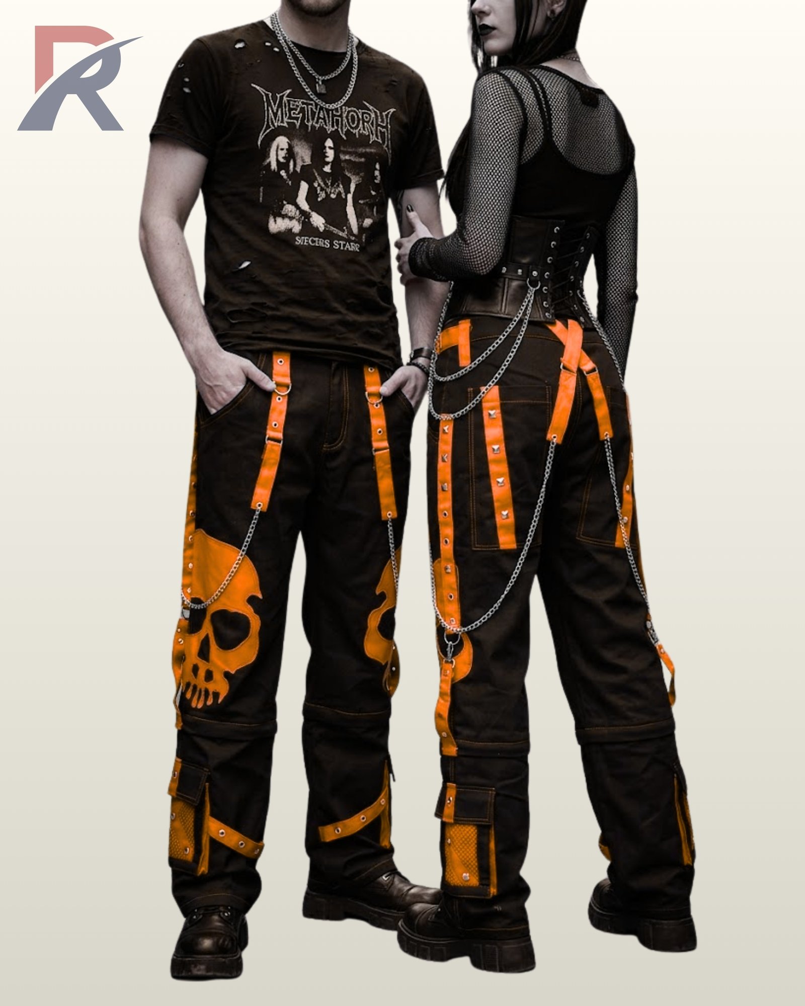 Gothic couple wearing wide-leg black pants detailed with neon orange skull artwork.