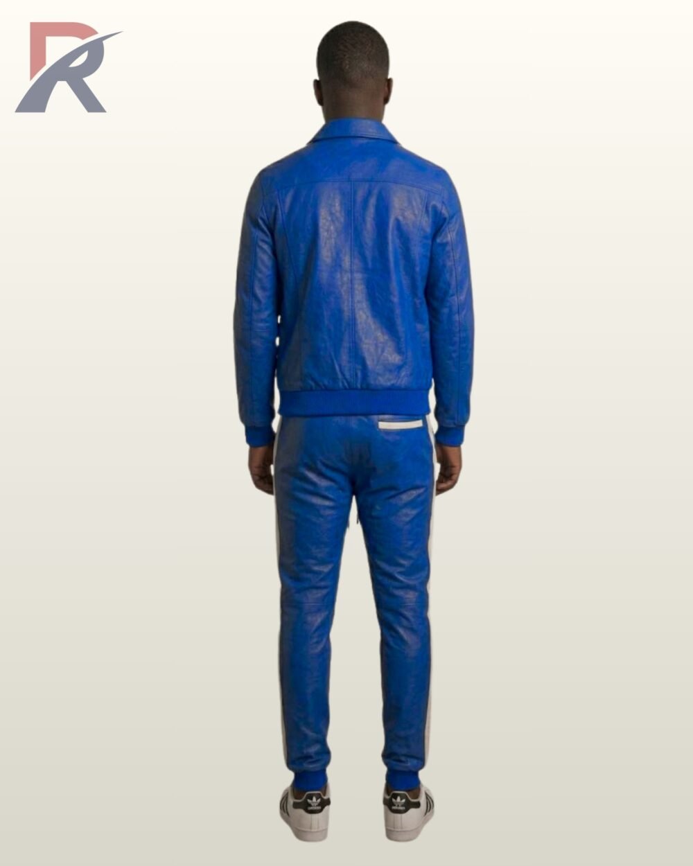 A premium blue leather casual track set worn with classic sneakers.